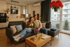 Lägenhet Deluxe - 1 sovrum | Vardagsrum | 125-centimeters platt-tv med kabelkanaler, Netflix och streamingtjänster