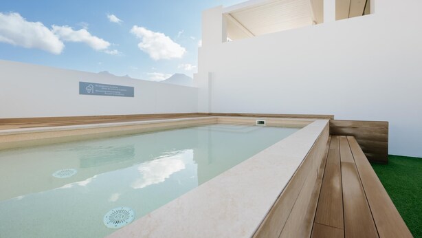 A modern indoor pool with a clear view of the sky and mountains in the background. - Apartment 3 bedroom | ground floor| mountain view (La Caleta)