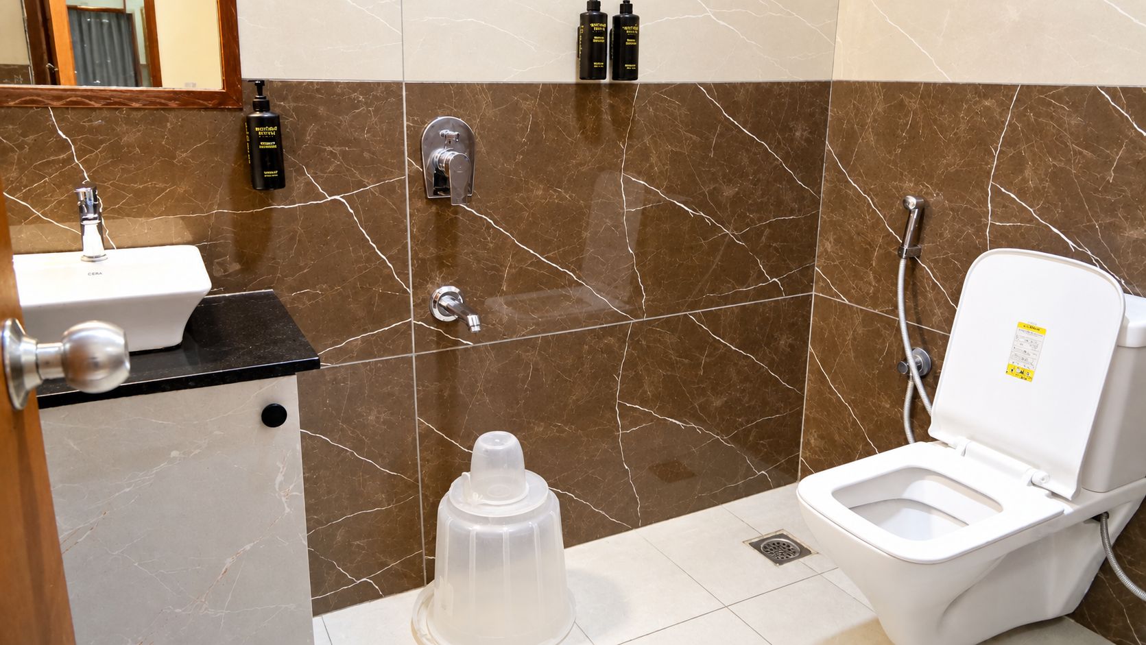 A bathroom with a sink, toilet, and shower.