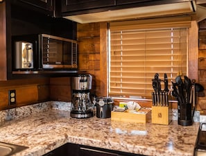 Fridge, microwave, stovetop, coffee/tea maker