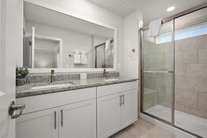 Shower, hair dryer, towels, shampoo
