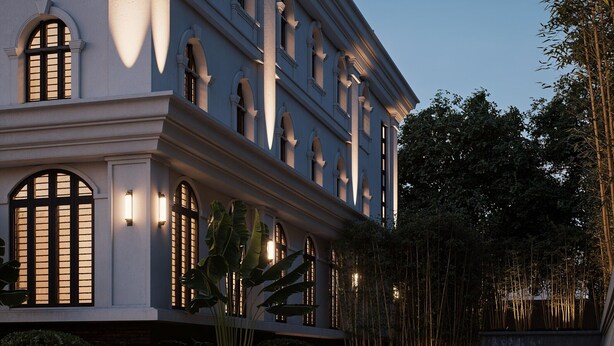 A large, multi-story building with arched windows and a balcony. - Horkeo Boutique Hotel  (Xam Neua)