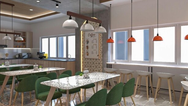 A modern kitchen with a central island, pendant lighting, and a coffee menu on the wall. - Lume Stay by Sinergi (Semarang)
