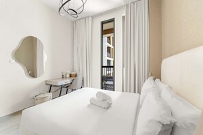 Desk, iron/ironing board, travel cot, WiFi - Stylish 1BR in Production City with pool and gym (Dubai)