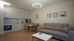 Comfort Apartment, City View | Living area | TV