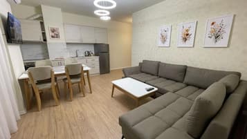 Superior Apartment, City View | Living area | TV