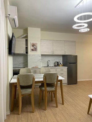 Superior Apartment, City View | Living area | TV