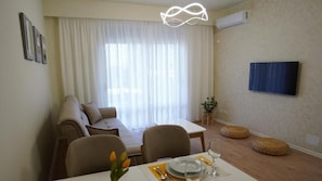 Comfort Apartment, City View | Living area | TV