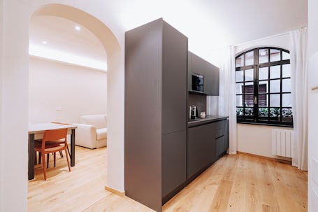 Standard Apartment | Living area | 32-inch flat-screen TV with satellite channels