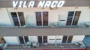 A building with the sign 'VILA NAO' above the entrance. - Vila Naço Ksamil (Ksamil)