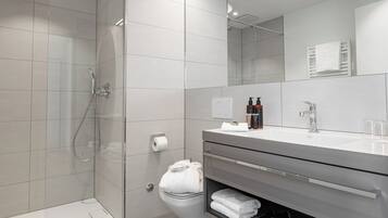 Shower, towels, soap, toilet paper