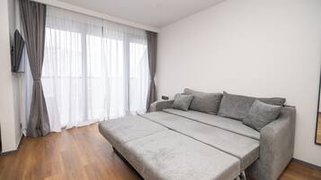 Suíte família, vista para a cidade | Espaço de trabalho para notebook, quartos à prova de som