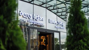 A hotel entrance with glass doors and signage for "BlueSky Apart Hotel". - Blue Sky Apart-hotel (Batumi)