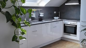 Fridge, microwave, stovetop, coffee/tea maker