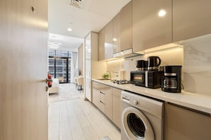 Fridge, microwave, stovetop, coffee/tea maker