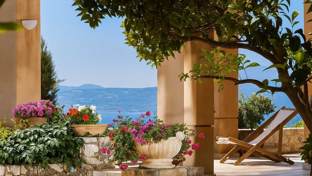 A terrace with stone steps, potted plants, and a wooden chair overlooking a scenic view. - Villa Vollard Panoramic Seaview Private Pool (Malevizi)