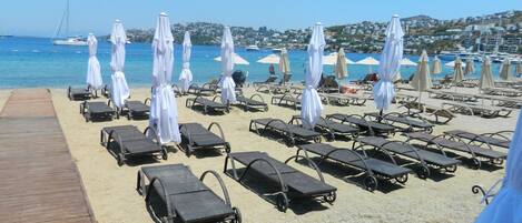 Private beach, free beach shuttle, free beach cabanas, sun-loungers