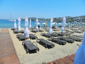 Private beach, free beach shuttle, free beach cabanas, sun-loungers