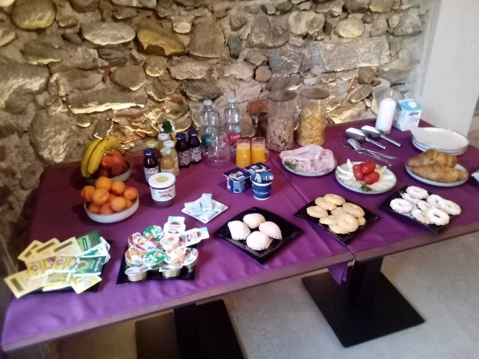 A breakfast buffet with various food items and beverages.