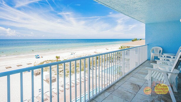 A balcony with a view of a beach and ocean. - Spacious Gulf Front Condo w/ Big Balcony - SD310 (Indian Shores)