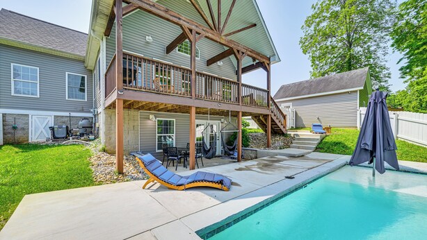 A two-story house with a balcony, a swimming pool, and outdoor furniture. - Pool, Lake Views, Dock & More: Mt Vernon Getaway (Mount Vernon)