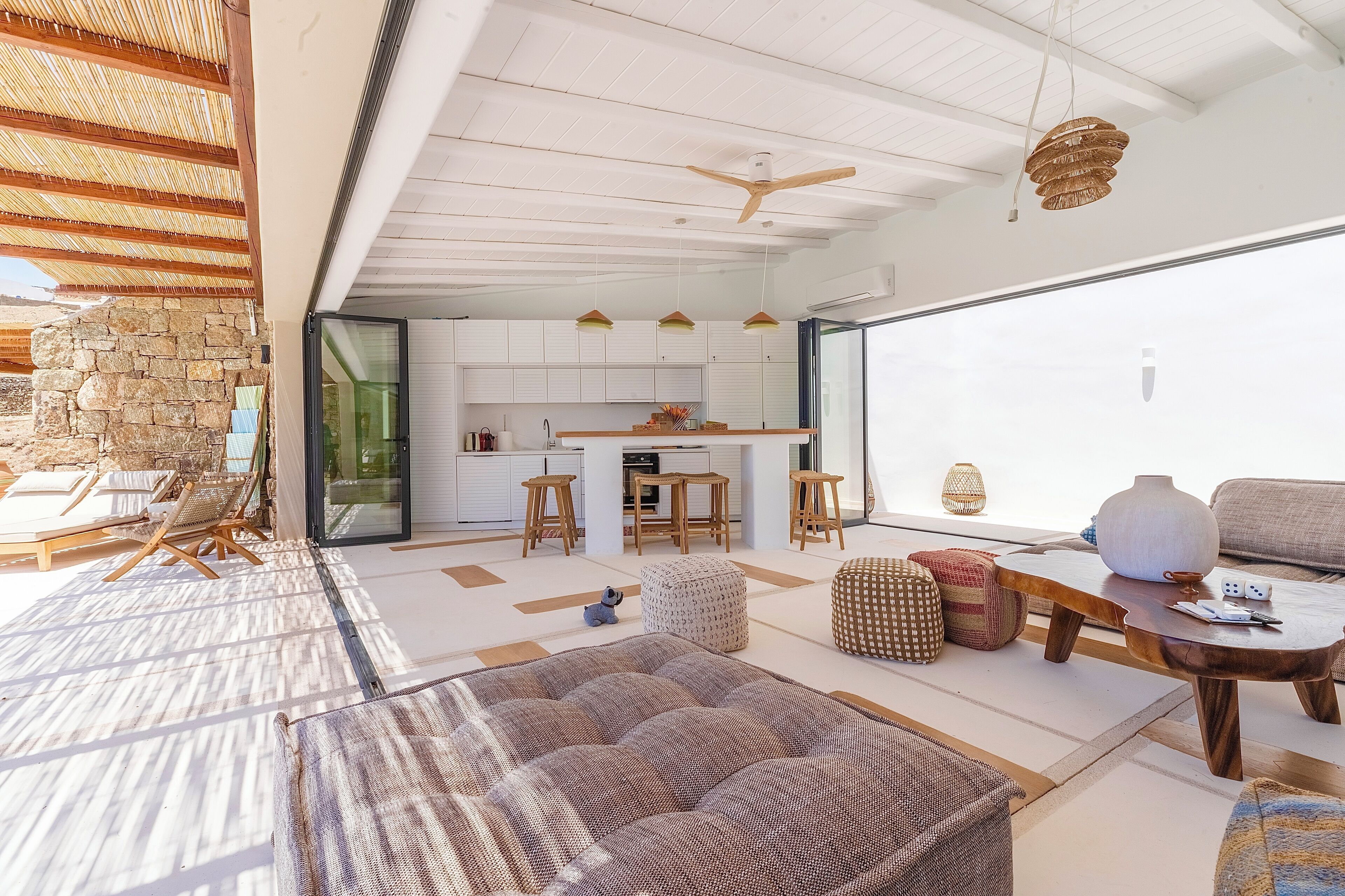 A modern interior with a kitchen, dining area, and living space.