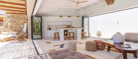 A modern interior with a kitchen, dining area, and living space.