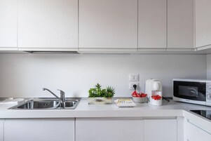 Apartment, 1 Double Bed with Sofa bed, Balcony | Private kitchen | Fridge, microwave, stovetop, dishwasher