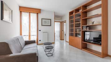 Condo, Balcony | Living area | 30-inch TV with digital channels