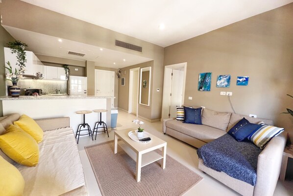 Basic Apartment | Living area | 55-inch Smart TV with cable channels