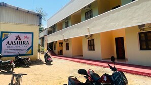 A residential building with a signboard for Aashira Residency A/C, indicating available car parking. - Aashira Residency (Mayiladuthurai)