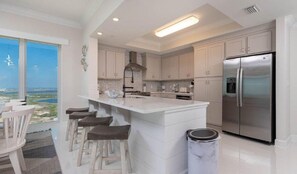 Condo, 4 Bedrooms | Private kitchen | Fridge, oven, coffee/tea maker