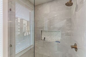 Shower, hair dryer, towels, shampoo