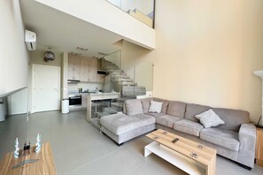 Basic Apartment | Living area | 55-inch Smart TV with cable channels - Xuru Stays I Eclectic 2 BDR Twin House @ Tawila El Gouna (El Gouna)