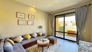 Appartement | Coin séjour | TV connectée de 55 pouces avec chaßnes par cùble
