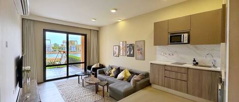 Basic Apartment | Living area | 55-inch Smart TV with cable channels