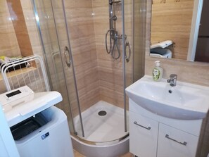 Shower, hair dryer, towels, soap