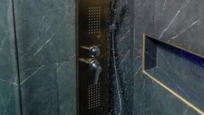 A modern shower with a control panel and a window. - Boss-Level Hideout! (edificio calamary)
