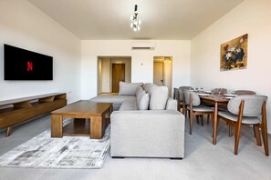 Basic Apartment | Living area | 55-inch Smart TV with satellite channels