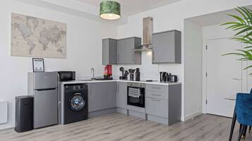 Modern fully equipped kitchen with dining area