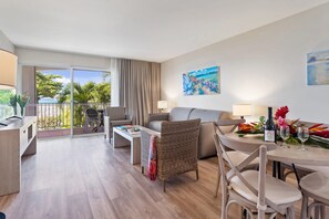 TV - Serene Beachfront Suite| Private Beaches, Balcony Views & Water Adventures (Grand-Case)