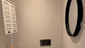 A small bathroom with a toilet, sink, and mirror. - Ground floor apartment in P. Delgada (Ponta Delgada)