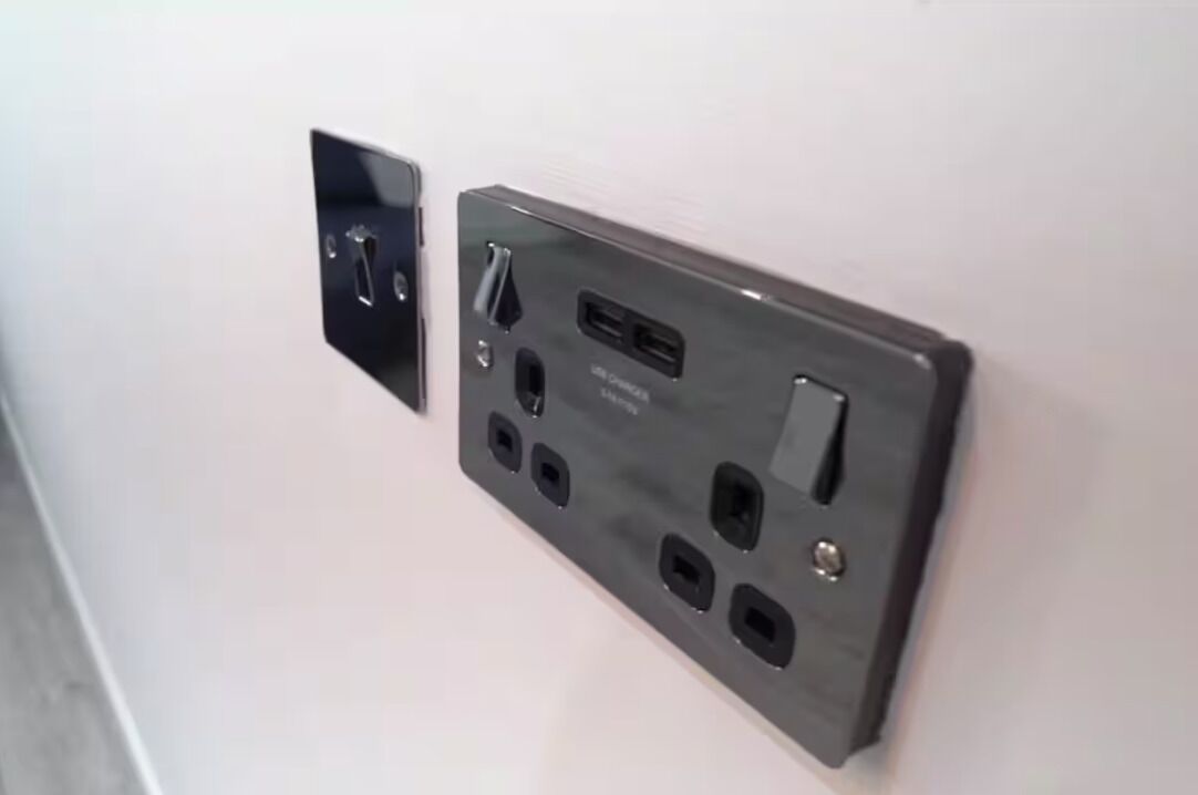 A wall-mounted electrical outlet with multiple USB ports and a standard electrical outlet.