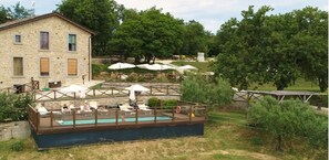 Outdoor pool, open 9:00 AM to 7:00 PM, pool umbrellas, pool loungers