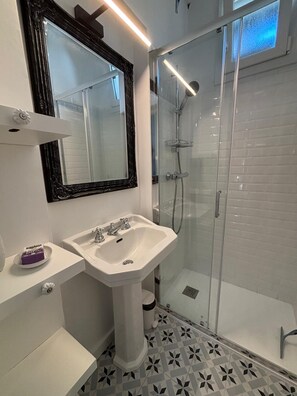 Shower, hair dryer, towels, soap