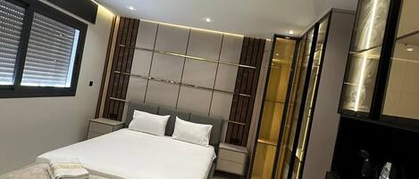 Luxury Studio Suite, City View | Blackout curtains, free WiFi