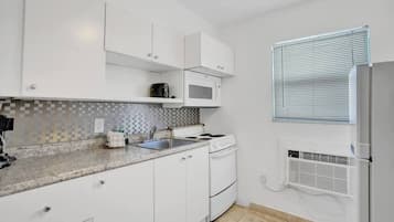 Classic Studio, Beach View (Waves 18) | Private kitchenette | Cookware/dishes/utensils
