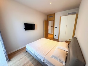 Premium bedding, desk, laptop workspace, blackout curtains