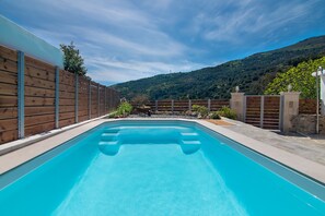 Outdoor pool, pool umbrellas, pool loungers