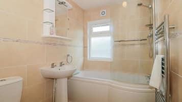 Combined shower/bathtub, deep-soaking bathtub, towels